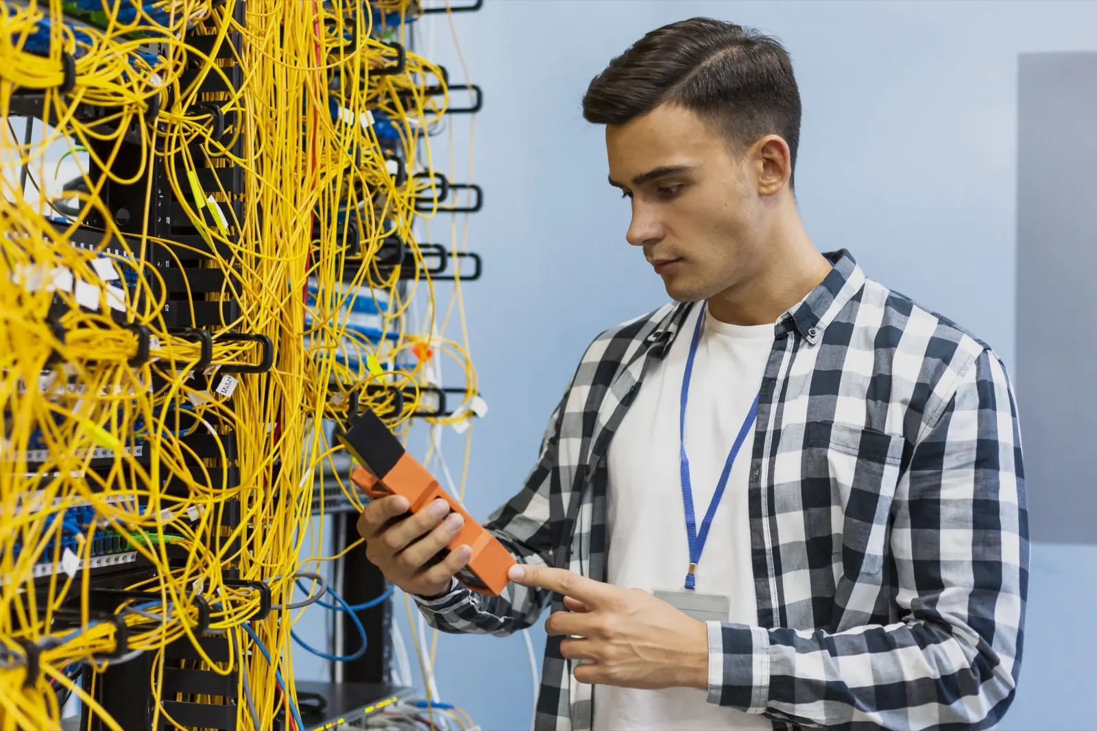 Network engineer testing fiber